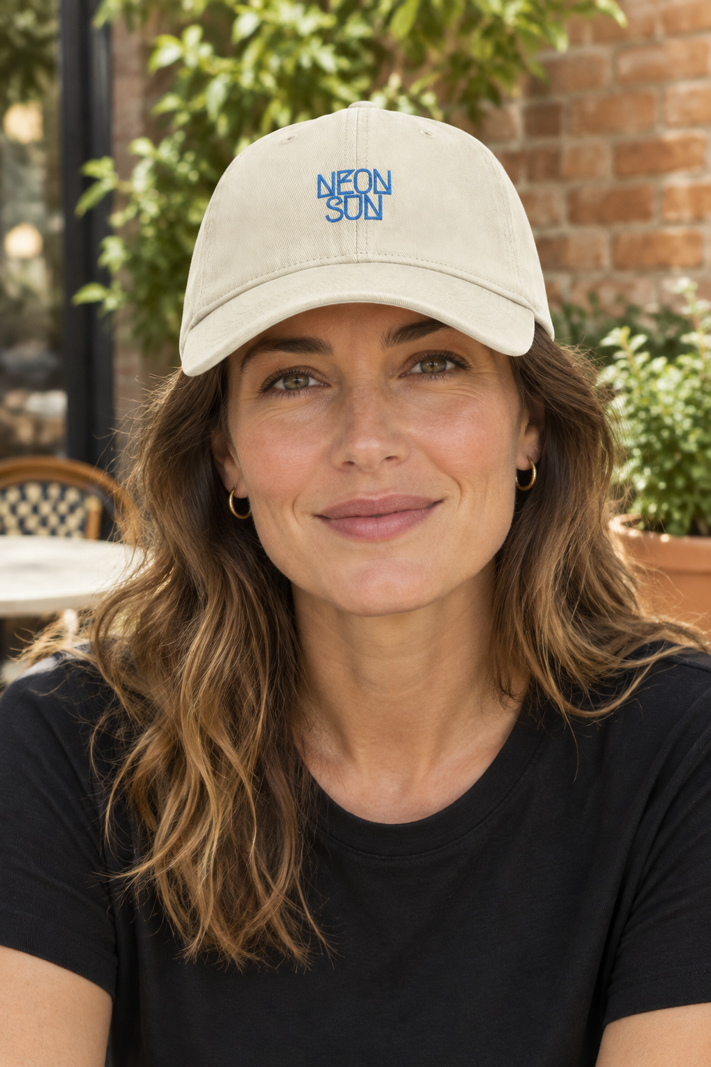Ivory NEON SUN cap lifestyle mockup on a woman in her late 30s